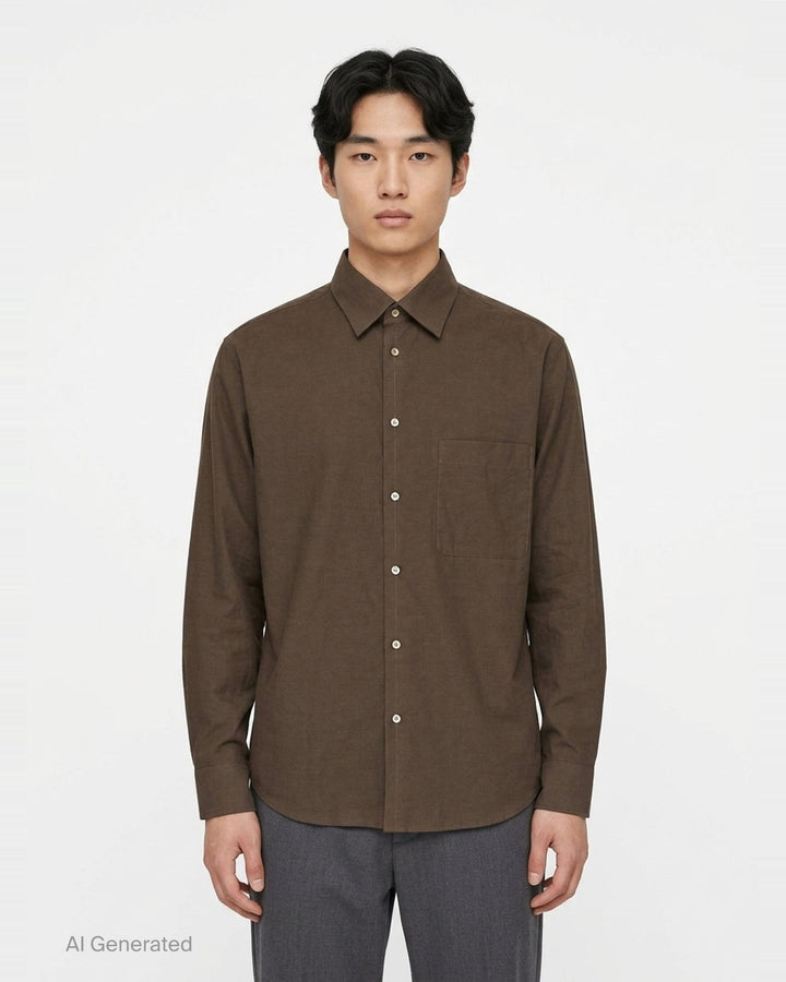 Lemaire Regular Long Sleeve Washed Cotton Shirt in slate grey, displayed flat against a white background, featuring a classic collar, white buttons, and a chest patch pocket - front