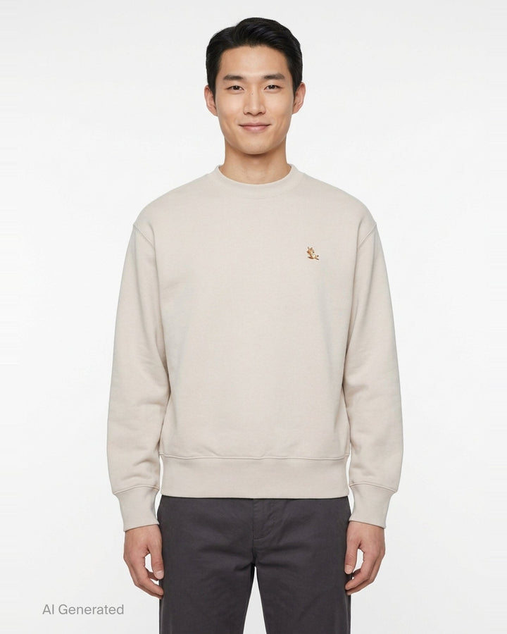 Maison Kitsuné Chillax Fox Comfort Sweatshirt in ivory with embroidered Chillax Fox motif on the chest, ribbed crew neck and cuffs, relaxed fit — front view - front