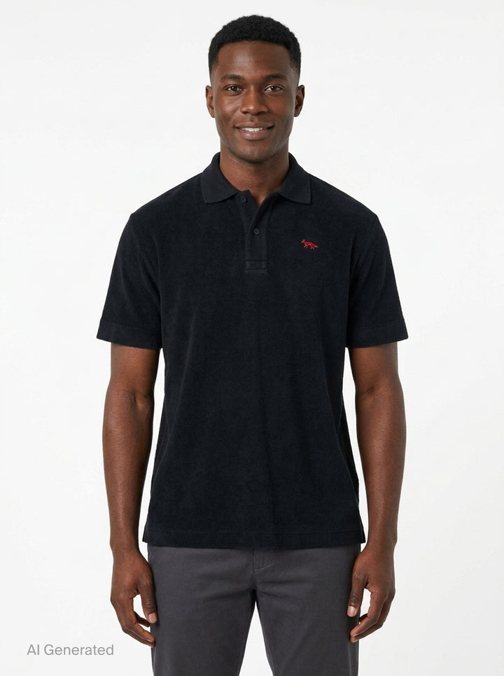 Maison Kitsuné black short sleeve comfort polo shirt with red embroidered running fox logo at the chest and three-button placket - front