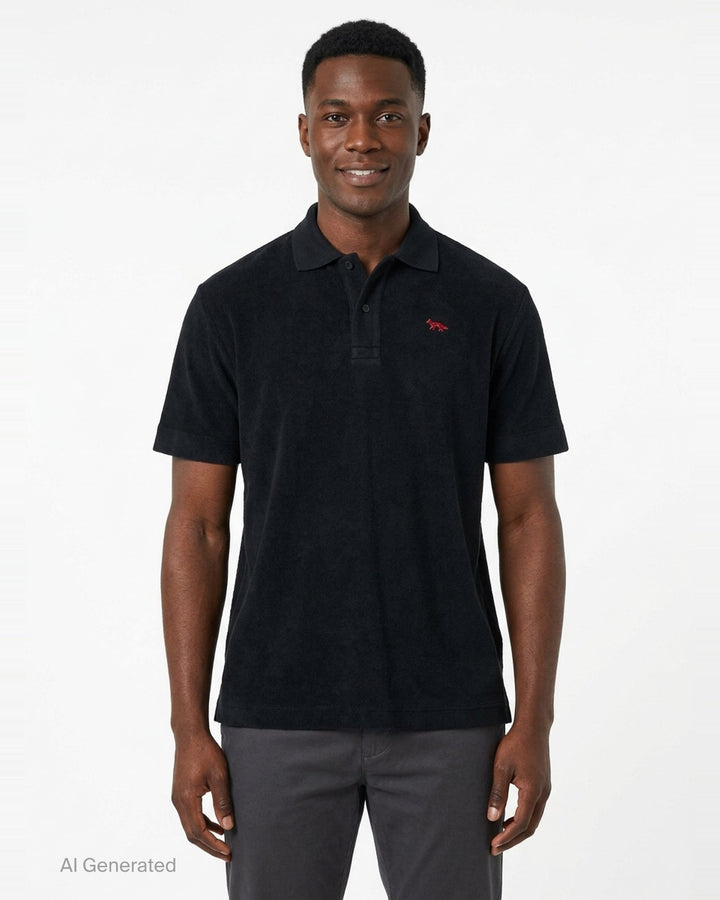 Maison Kitsuné black short sleeve comfort polo shirt with red embroidered running fox logo at the chest and three-button placket - front
