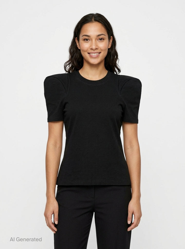 Melitta Baumeister Foamy Shoulder Tee in black, featuring exaggerated sculptural puff shoulders, ribbed crew neckline, and a fitted short-sleeve silhouette, shown on a flat lay against a white background - front