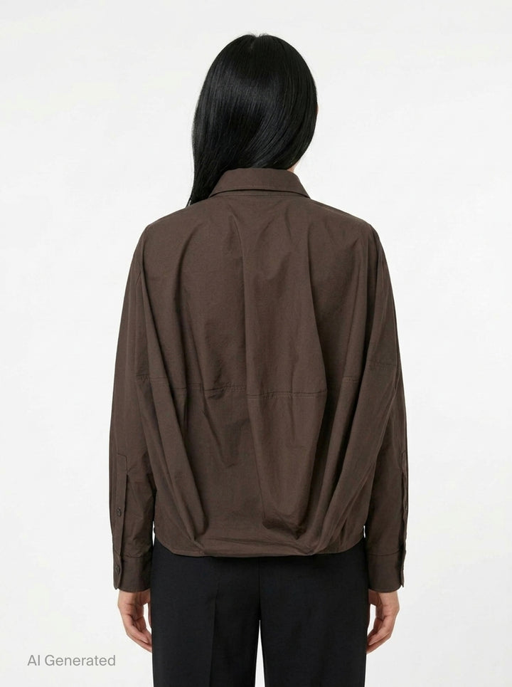 Melitta Baumeister Long Sleeve Cocoon Shirt in chocolate brown with rounded collar, contrast topstitching, chest patch pocket, and gathered elasticated hem band - back