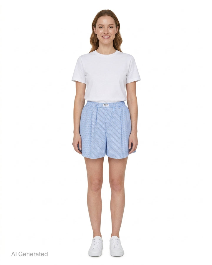 MSGM diagonal stripe shorts in light blue with a flared silhouette, elasticated waistband, and woven MSGM Milano label, front view on white background - front