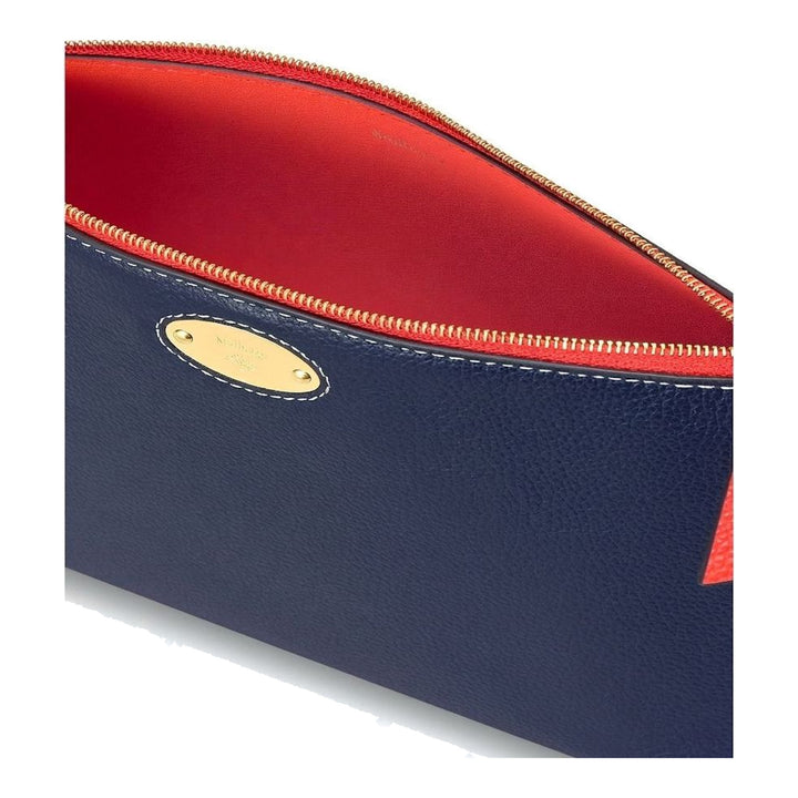 Mulberry Plaque Cosmetic Pouch in navy grained leather with contrast red zip, white contrast stitching, and a gold-tone oval Mulberry plaque on the front - packshot