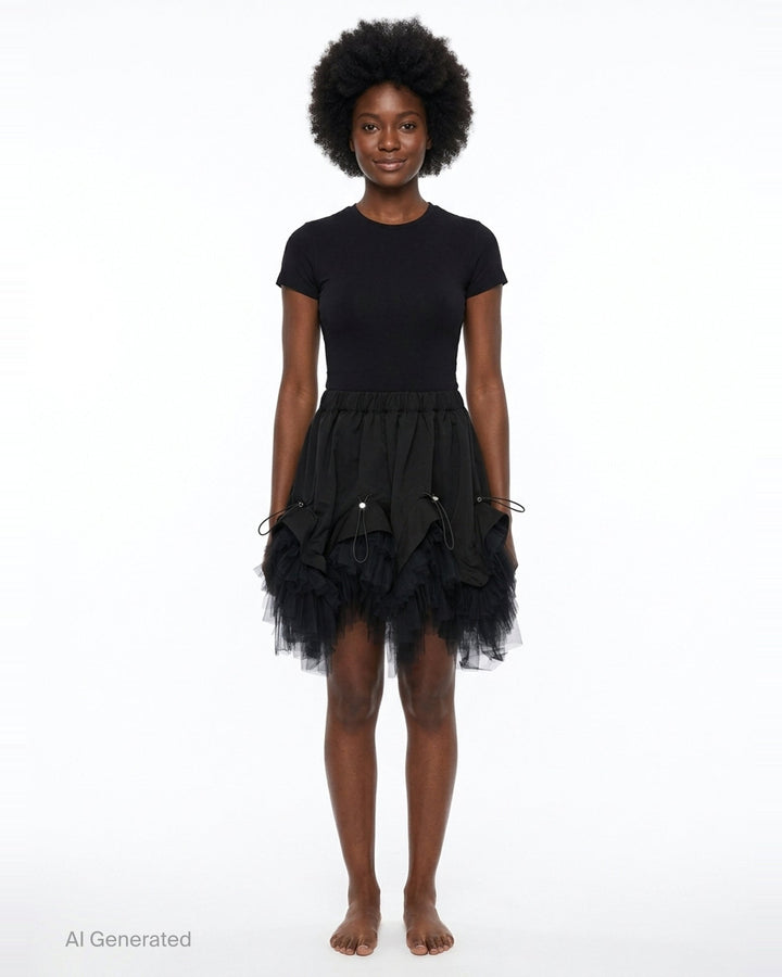 Noir Kei Ninomiya black elasticated waistband mini skirt with ruched woven panels, adjustable drawstring toggles, and layered tiered tulle hem, photographed flat on white background - front