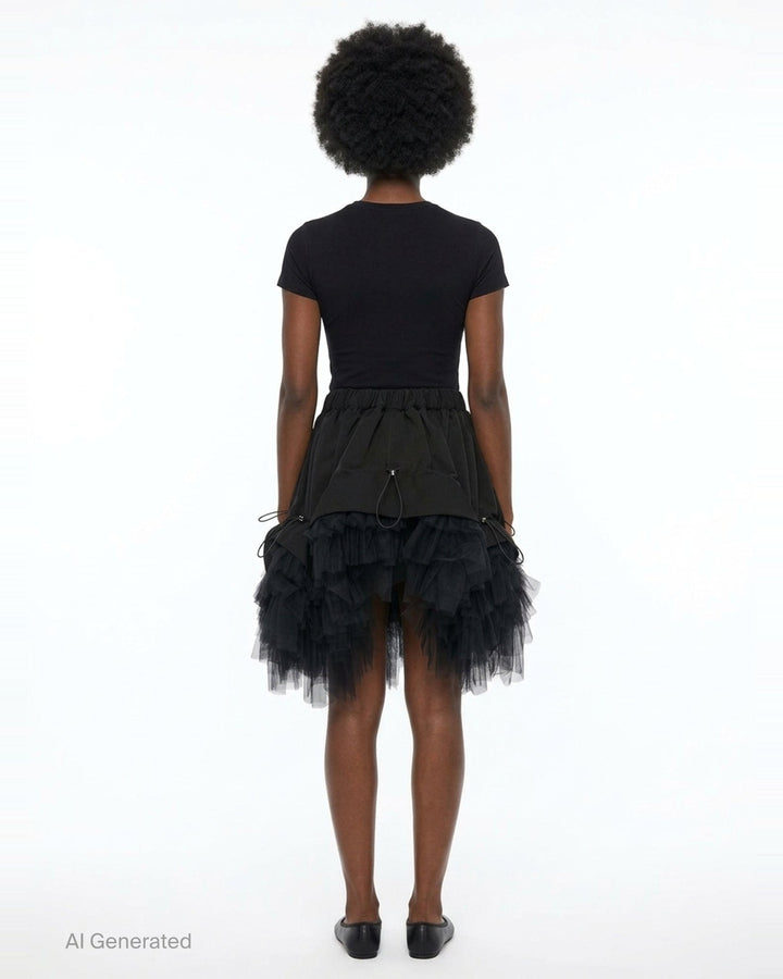 Noir Kei Ninomiya black elasticated waistband mini skirt with ruched woven panels, adjustable drawstring toggles, and layered tiered tulle hem, photographed flat on white background - back