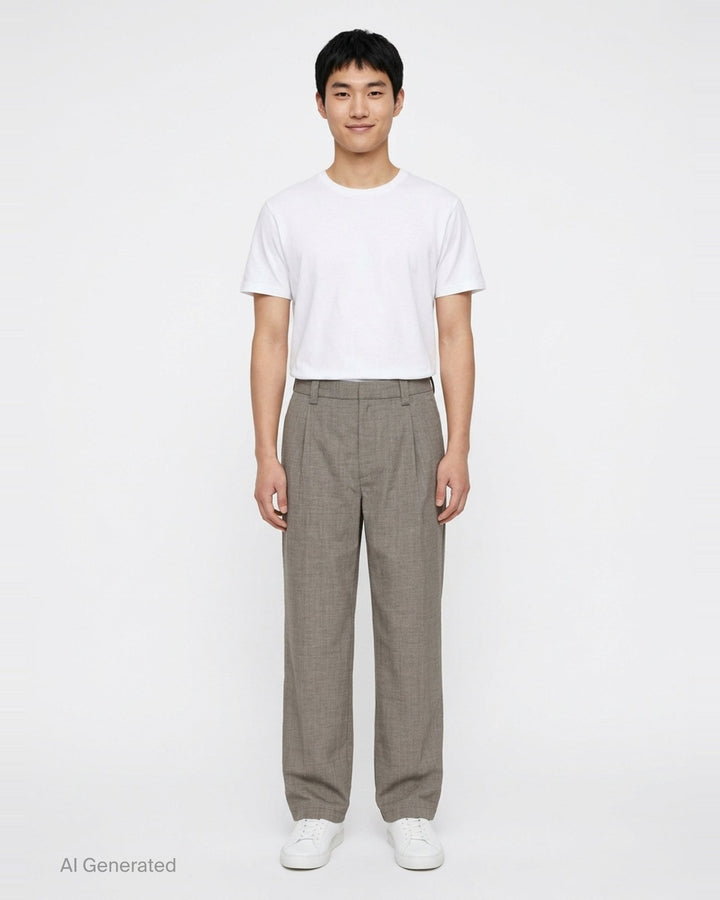 Our Legacy Still Chino Pants in heathered grey — wide-leg tailored trousers with double pleats and turn-up cuffs, front view on white background - front