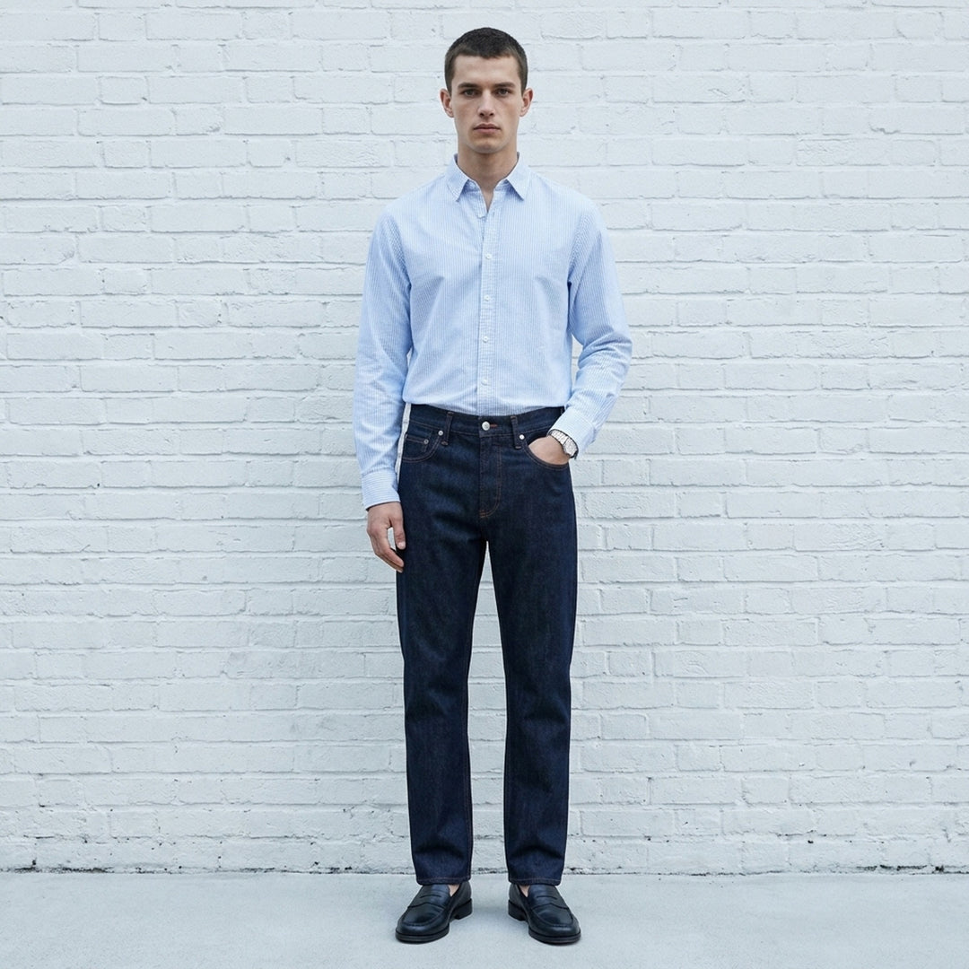 rag & bone Fit 3 Raw Stretch Jeans in dark indigo with contrast amber topstitching and straight-leg silhouette, front view - lifestyle