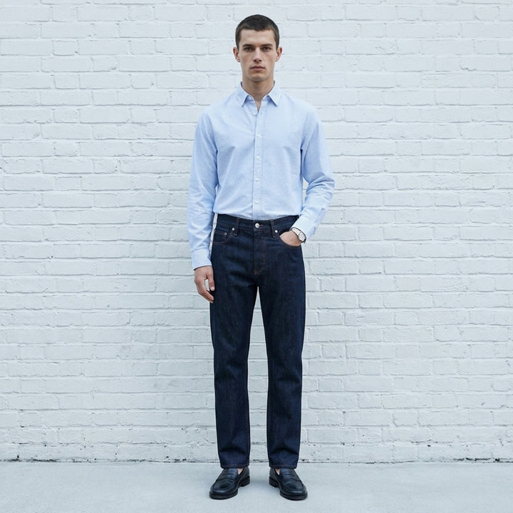 rag & bone Fit 3 Raw Stretch Jeans in dark indigo with contrast amber topstitching and straight-leg silhouette, front view - lifestyle