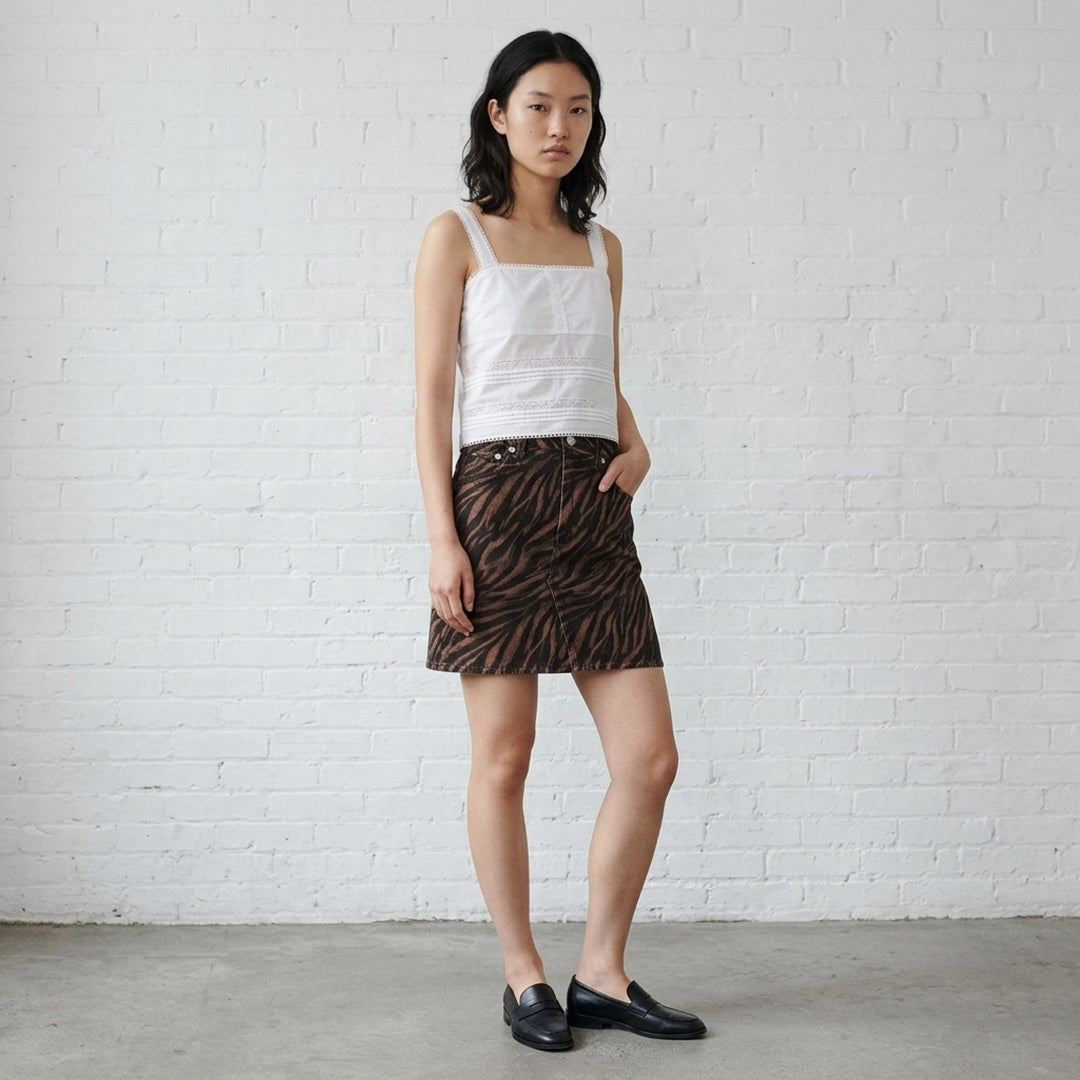 rag & bone Miramar Zebra Mini Skirt in brown and black animal print denim with high waist, silver-tone hardware, and five-pocket styling - lifestyle