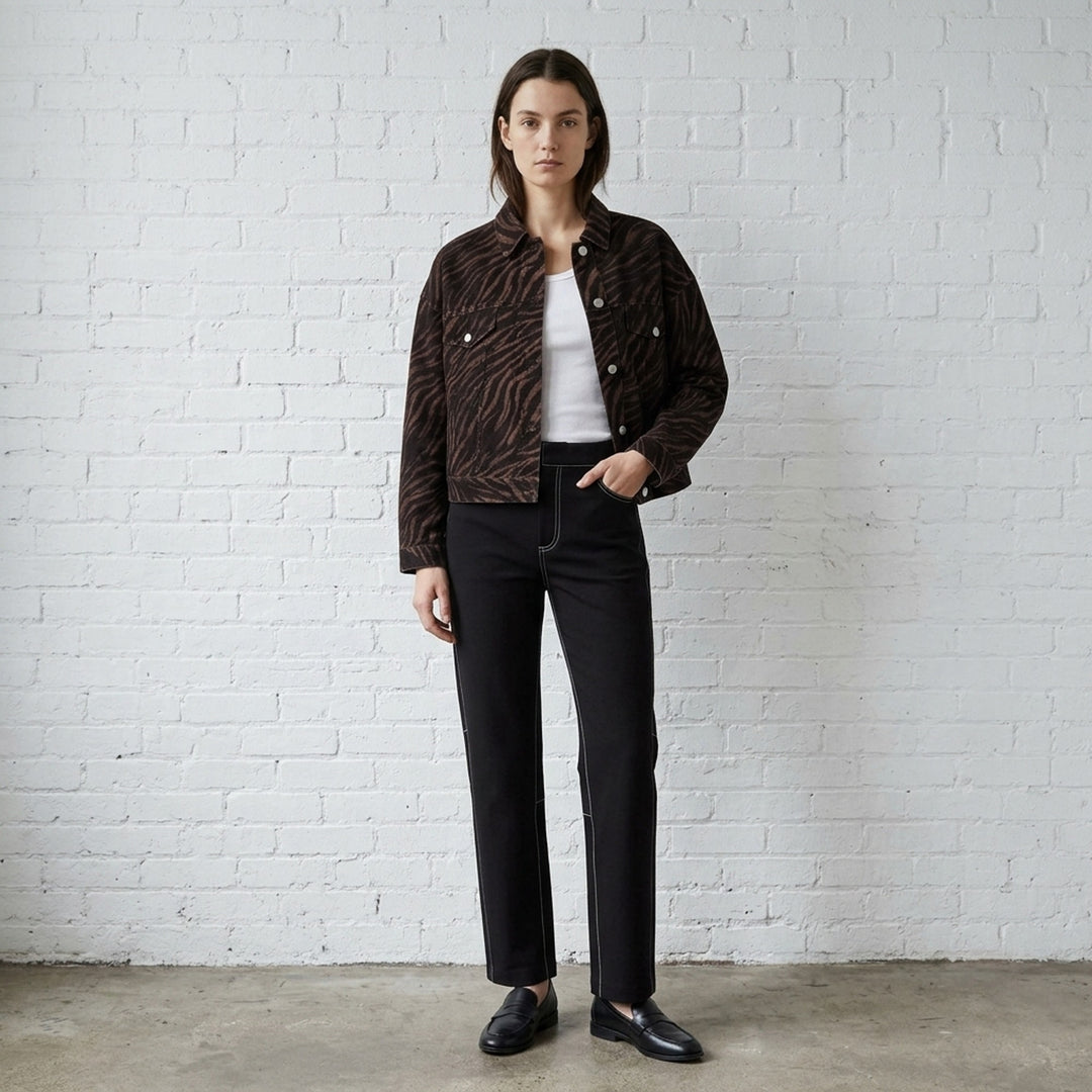 rag & bone Miramar Ponte Zebra Trucker Jacket in tonal brown and black zebra print with silver snap-button closures and dual chest pockets, front view on white background - lifestyle