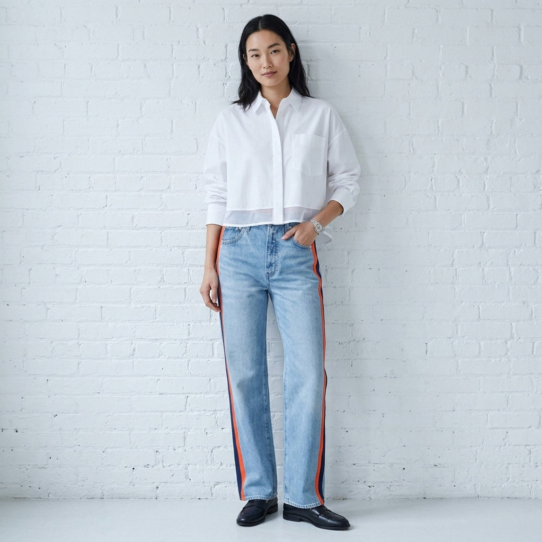rag & bone washed black wide-leg jeans with contrast green and white side stripes along the outer seams, high-rise fit, five-pocket construction - lifestyle