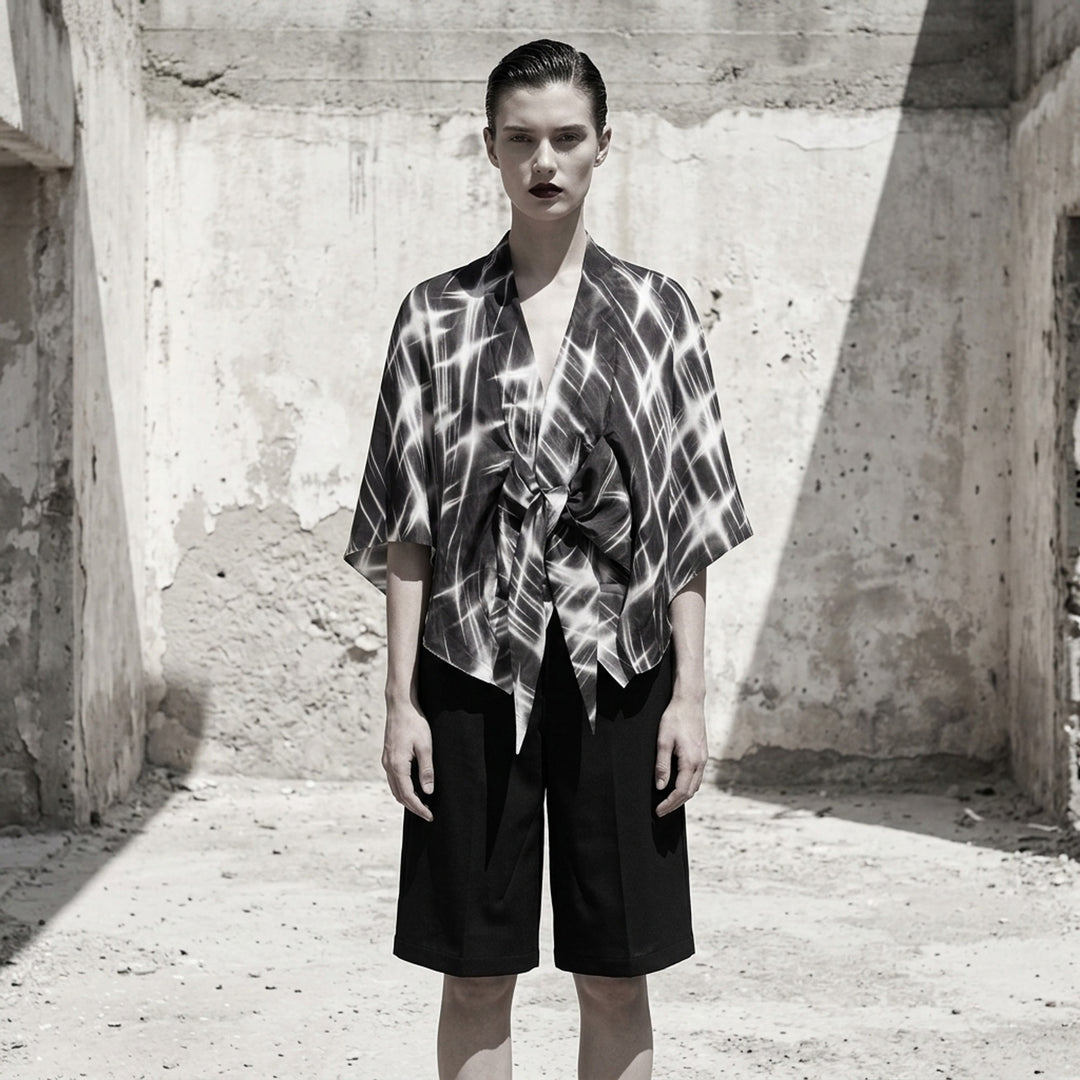 Rick Owens Half Moon wrap top in a black and white starburst print with a kimono-style silhouette and knotted tie front - lifestyle