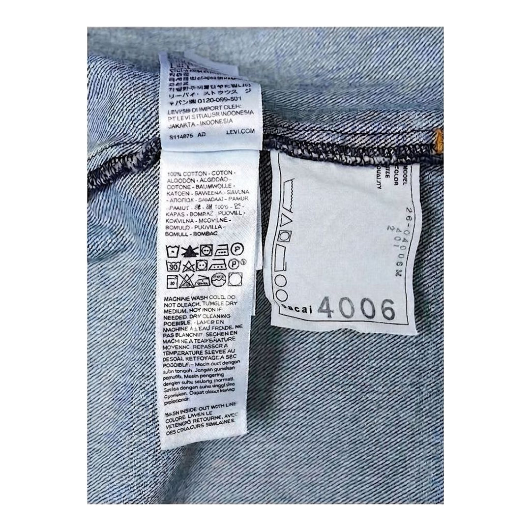sacai x Levi's denim blouson jacket in stonewashed indigo with white zip front, flap chest pockets and sleeve zip pocket - packshot