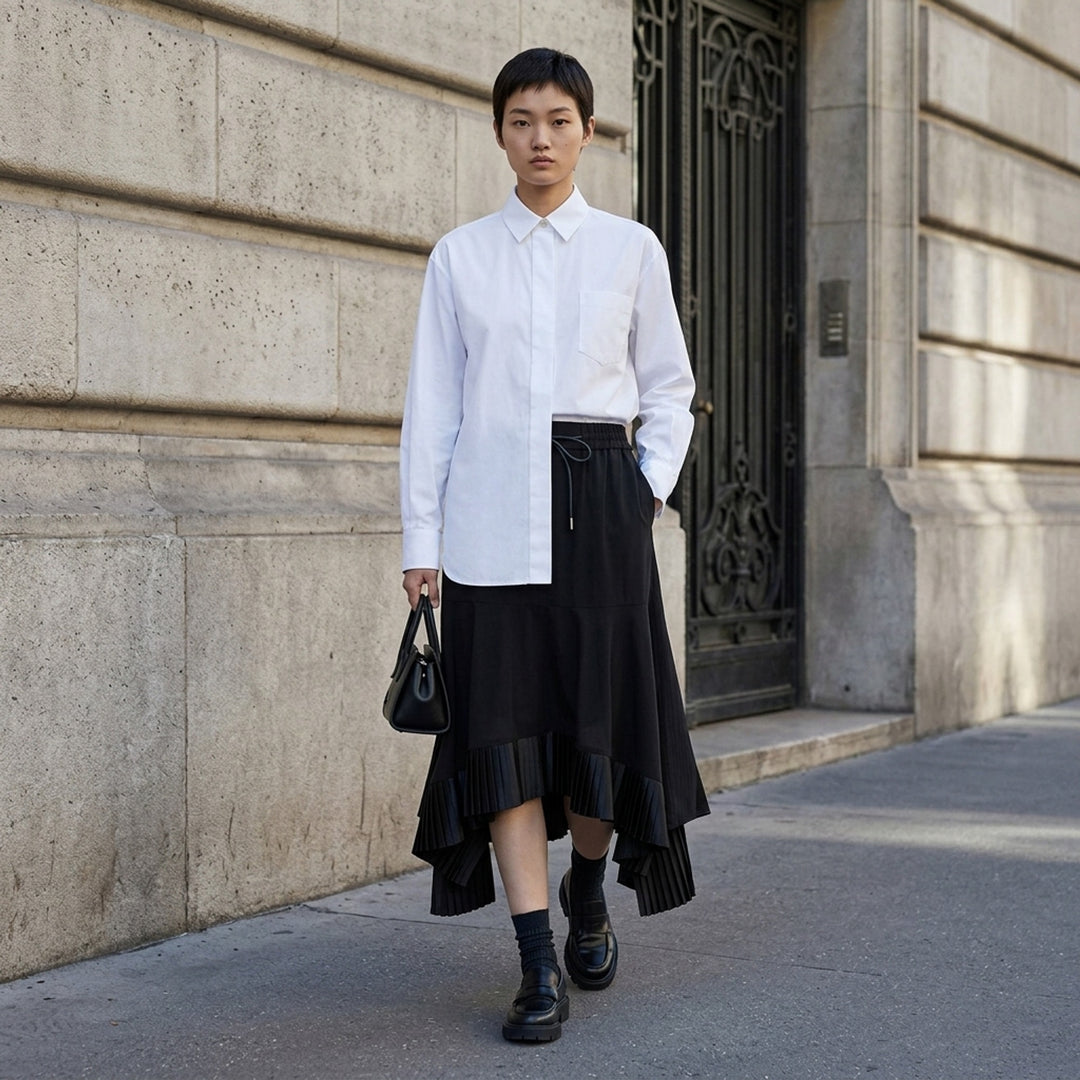 sacai black poplin long sleeve shirt with concealed front placket, point collar, chest pocket, and button-fastened cuffs, shown flat on white background - lifestyle