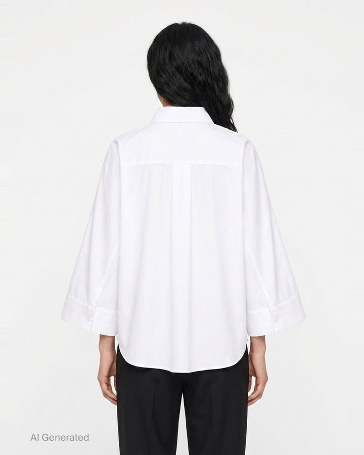 sacai Wide Sleeve Poplin Shirt in black, featuring a concealed button placket, point collar, flared long sleeves with deep cuffs, a chest patch pocket, and twin lower patch pockets - back
