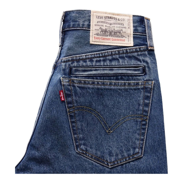 sacai x Levi's mid-blue washed flare jeans with an integrated black woven belt, shown from the front - packshot