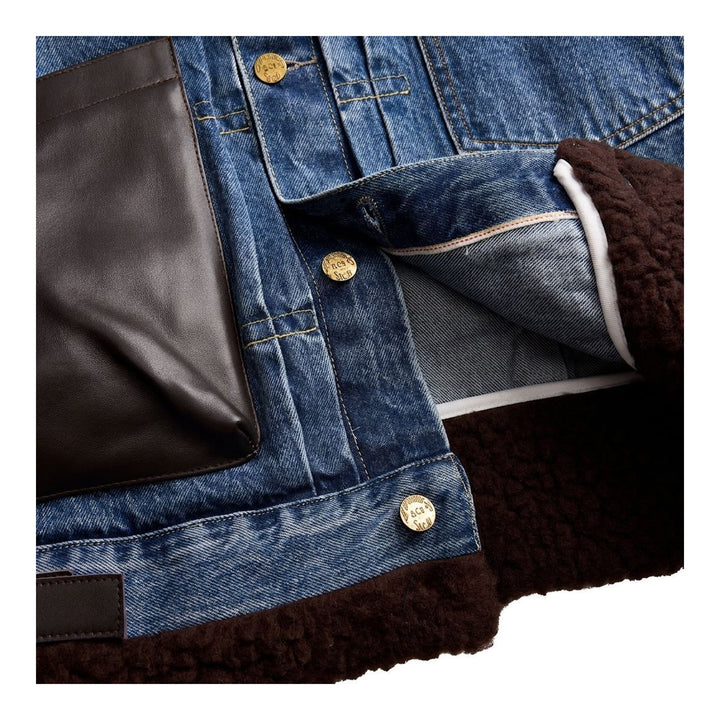 sacai Holiday Capsule mid-blue denim blouson with brown sherpa collar, cuffs and hem, an oversized leather front pocket and buckled side straps - packshot