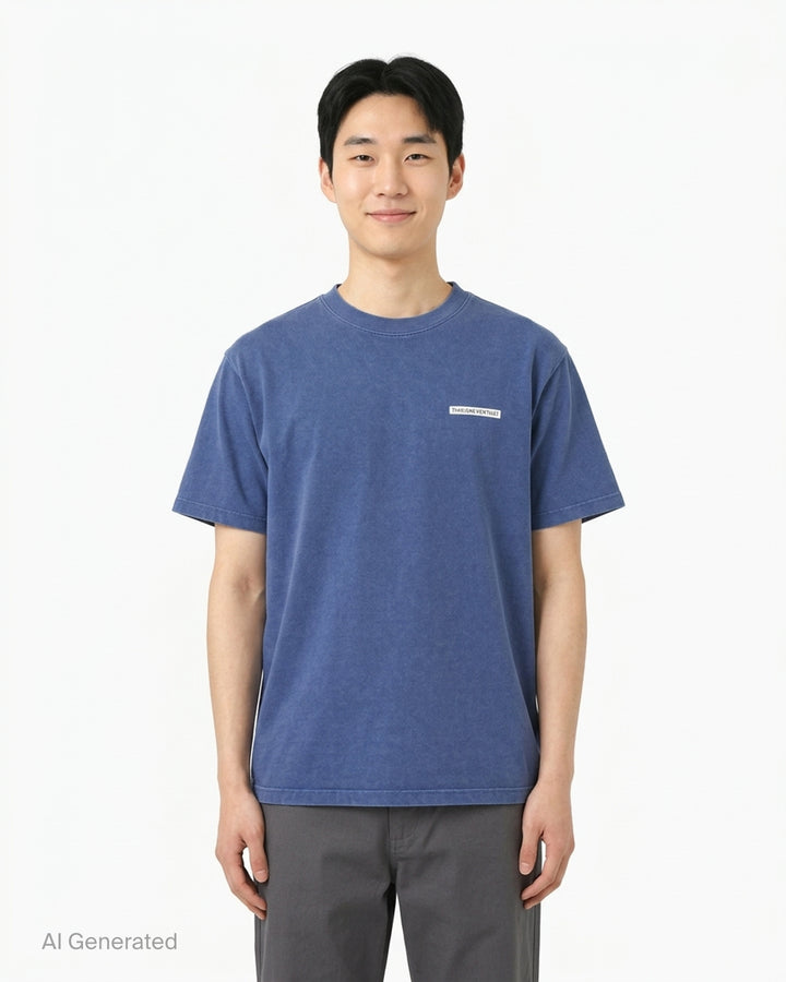 thisisneverthat Saturn short sleeve tee in washed black with a small woven brand logo label at the chest and a ribbed crewneck collar, displayed flat on a white background - front