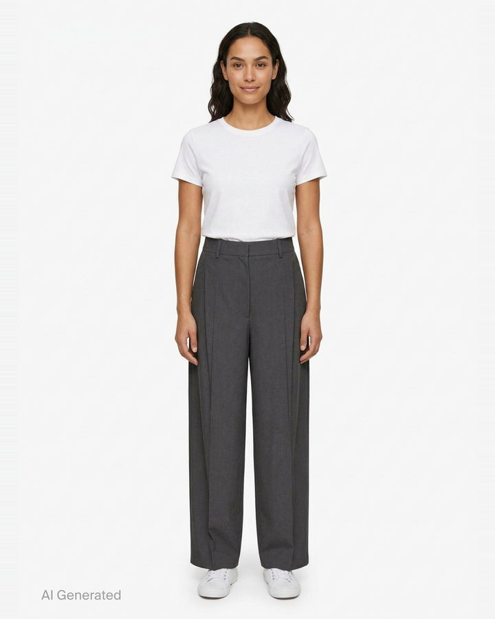 Totême High-Waist Pleated Trousers in charcoal grey, featuring front double pleats, a wide-to-tapered leg, and a structured high-rise waistband, shown flat on a white background - front