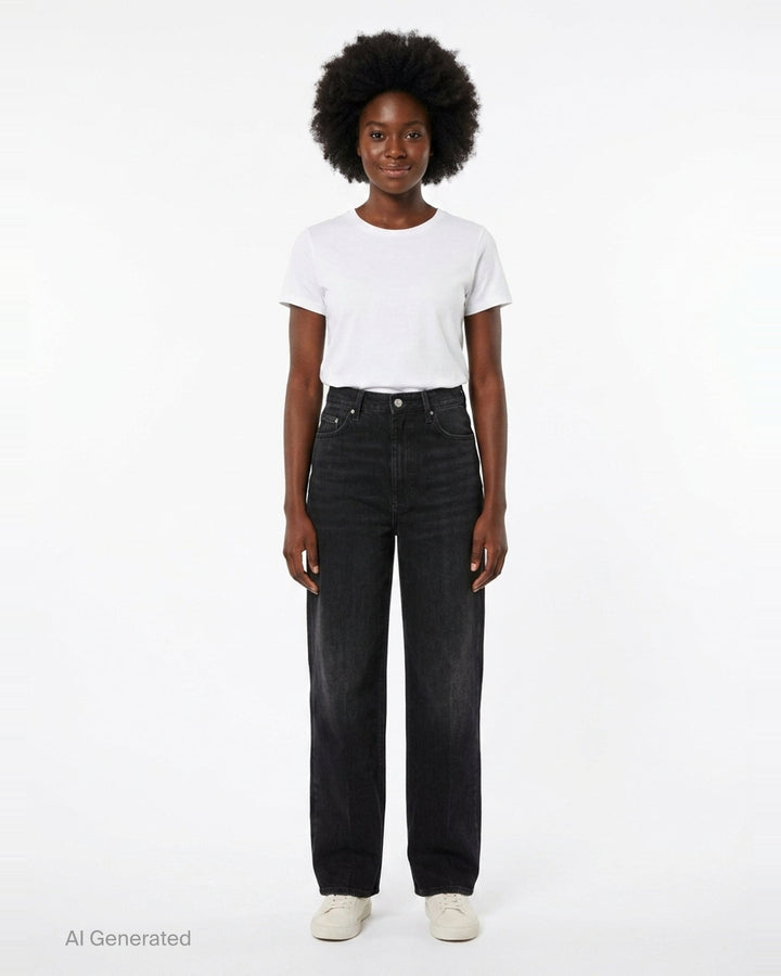 Totême Wide Leg Jeans in washed black denim, featuring a high-rise waist, five-pocket construction, and a relaxed straight-falling leg, shown flat against a white background - front