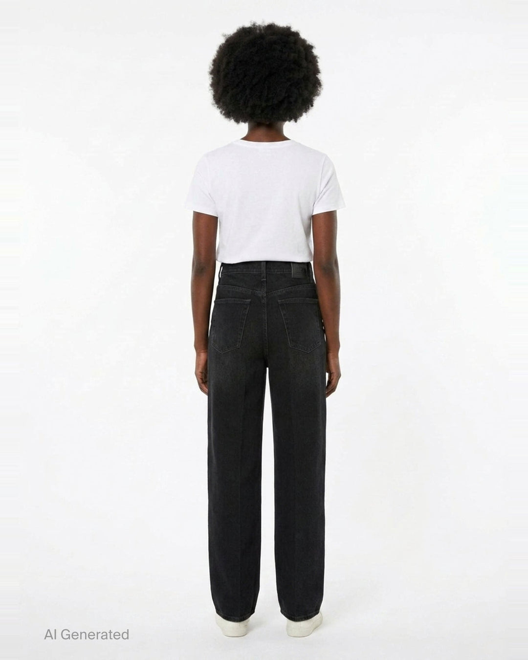 Totême Wide Leg Jeans in washed black denim, featuring a high-rise waist, five-pocket construction, and a relaxed straight-falling leg, shown flat against a white background - back