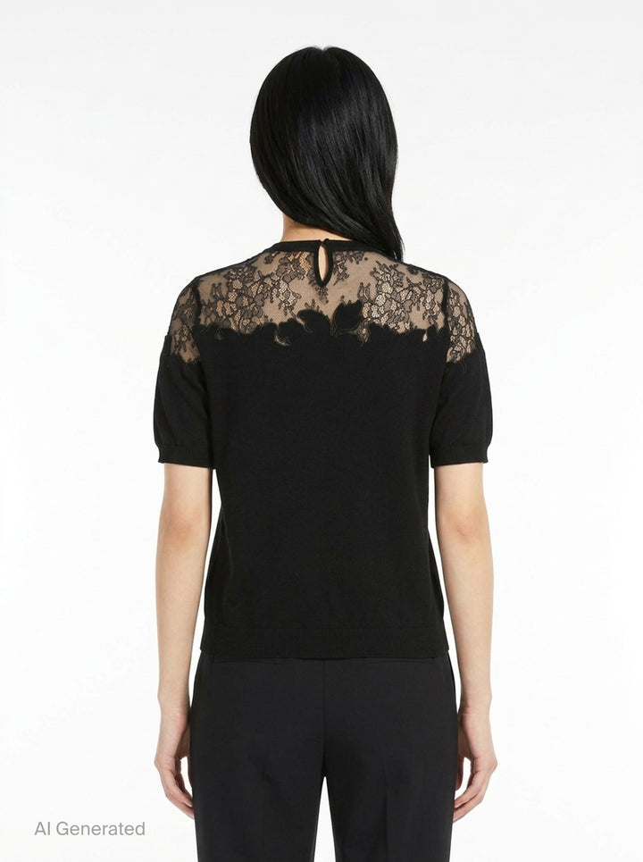 Ulla Johnson Ella Short Sleeve Lace Top in black, featuring a sheer floral embroidered lace yoke, puffed short sleeves, and a fine-knit body with keyhole back closure - back
