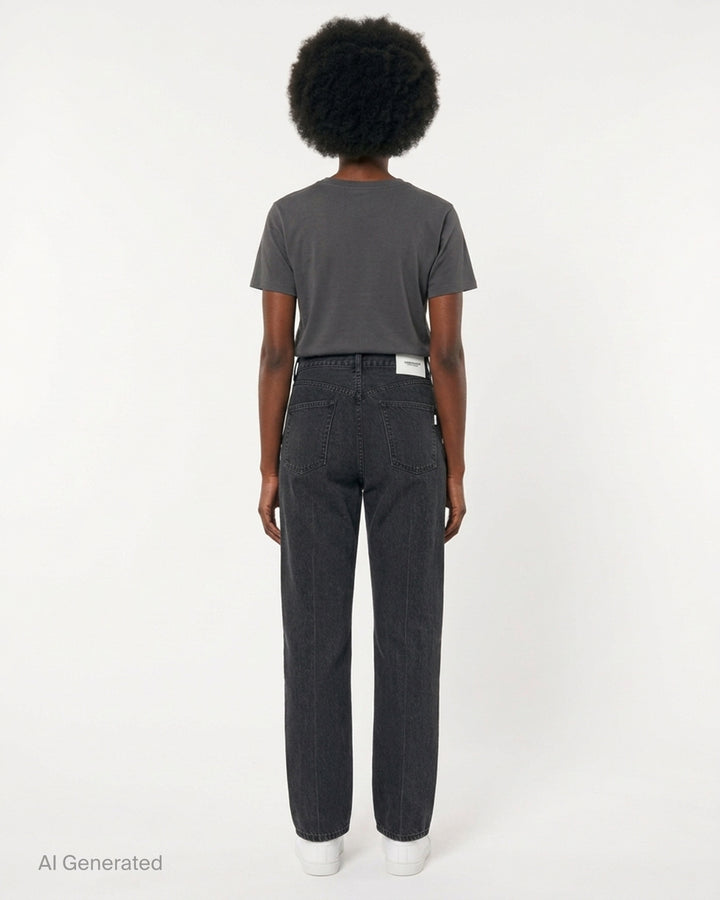 Undercover washed black straight-leg jeans with a white floral lace strip across the knee, shown from the front - back