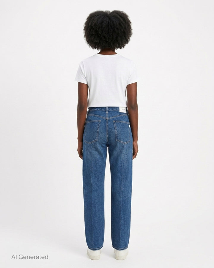 Undercover washed black straight-leg jeans with a white floral lace strip across the knee, shown from the front - back