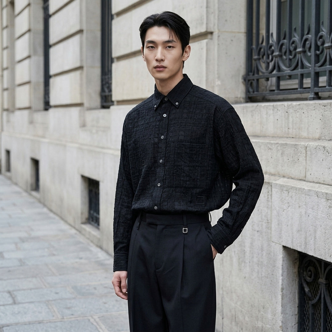 Wooyoungmi Crinkled Texture Long Sleeve Shirt in black, featuring a semi-sheer tonal plaid weave, button-down collar, chest patch pocket, and tone-on-tone Wooyoungmi Paris logo - lifestyle