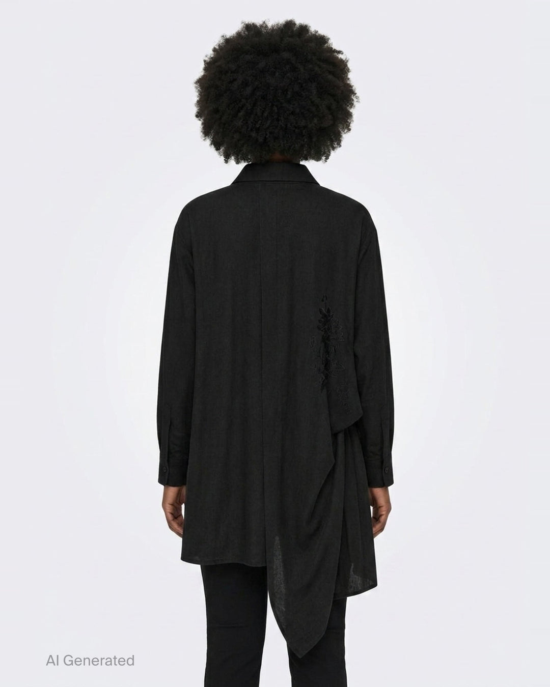 Yohji Yamamoto Tuck & Drape Blouse in black, featuring an asymmetric draped hem, button-through front, point collar, and long sleeves with buttoned cuffs - back