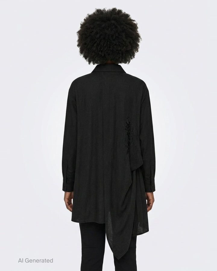 Yohji Yamamoto Tuck & Drape Blouse in black, featuring an asymmetric draped hem, button-through front, point collar, and long sleeves with buttoned cuffs - back