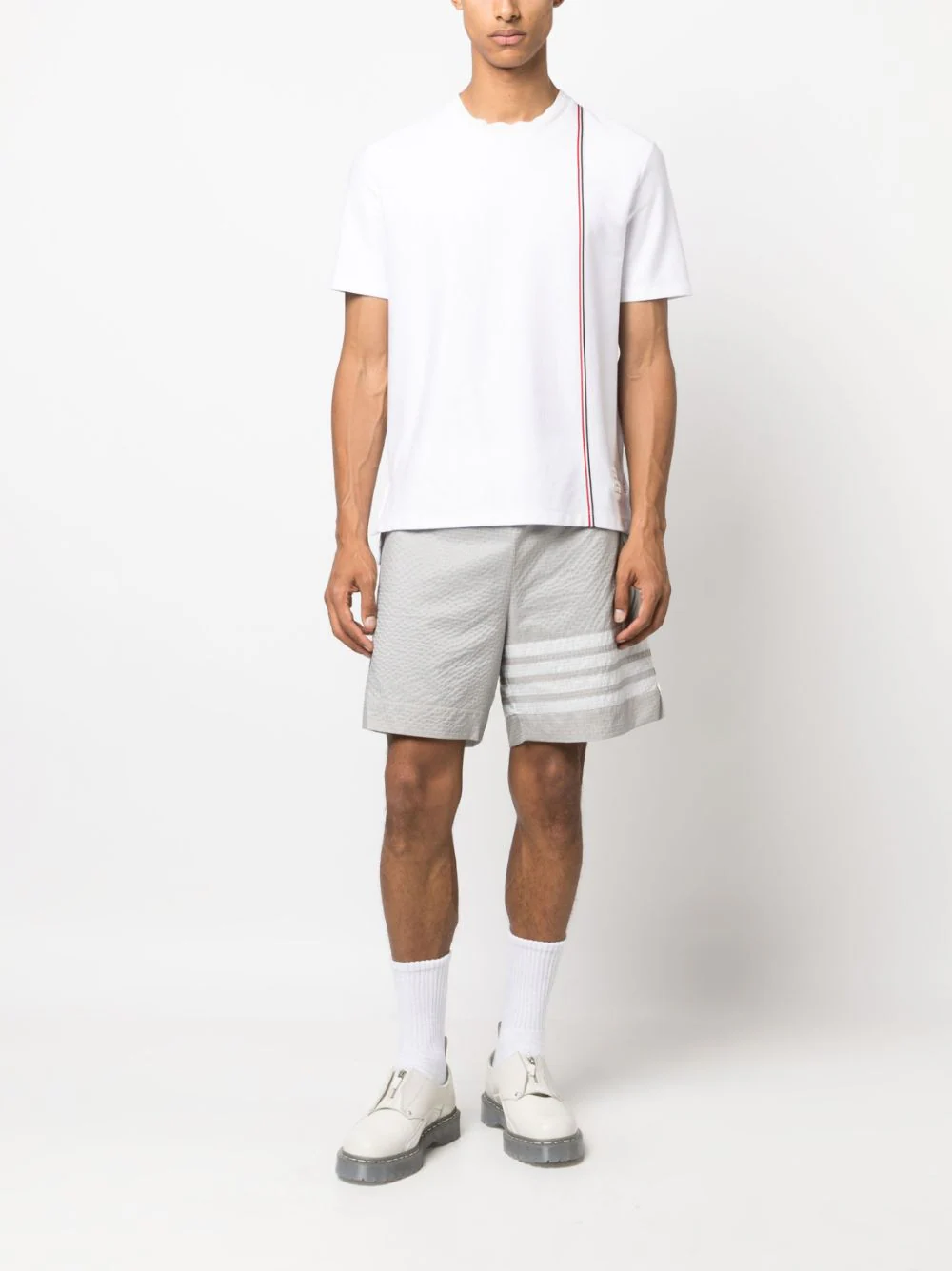 Thom Browne navy medium weight crew neck T-shirt with diagonal red, white, and blue grosgrain stripe on the front, made in Italy